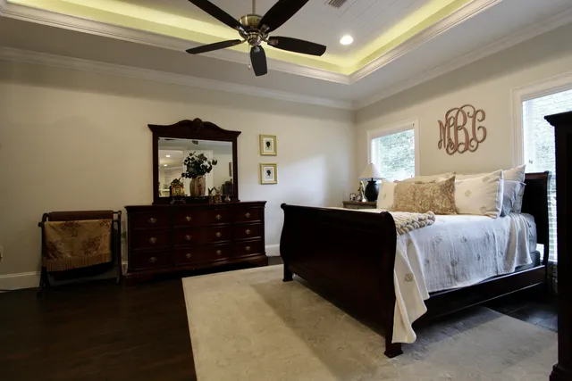 a bedroom with a bed and a dresser