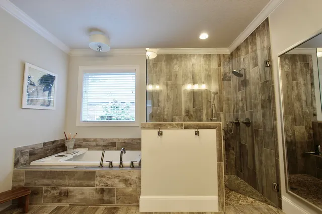 a bathroom with a tub sink and shower