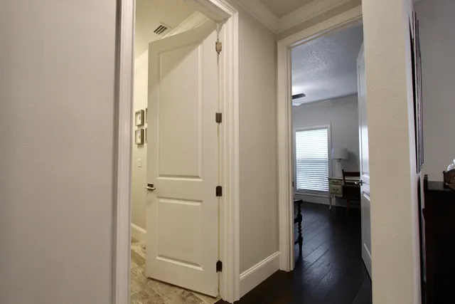a view of a bathroom from a hallway