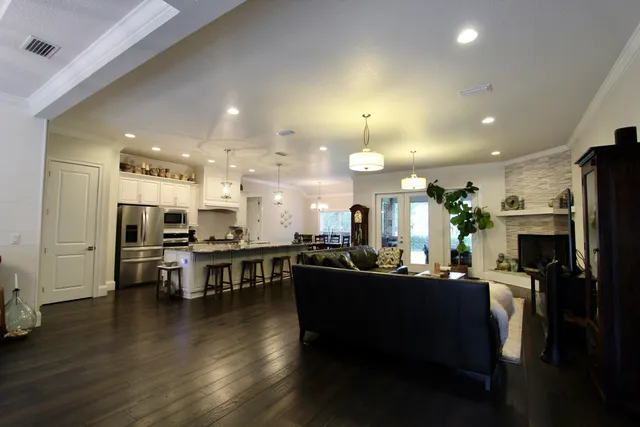 a view of a dining room with furniture and wooden floor