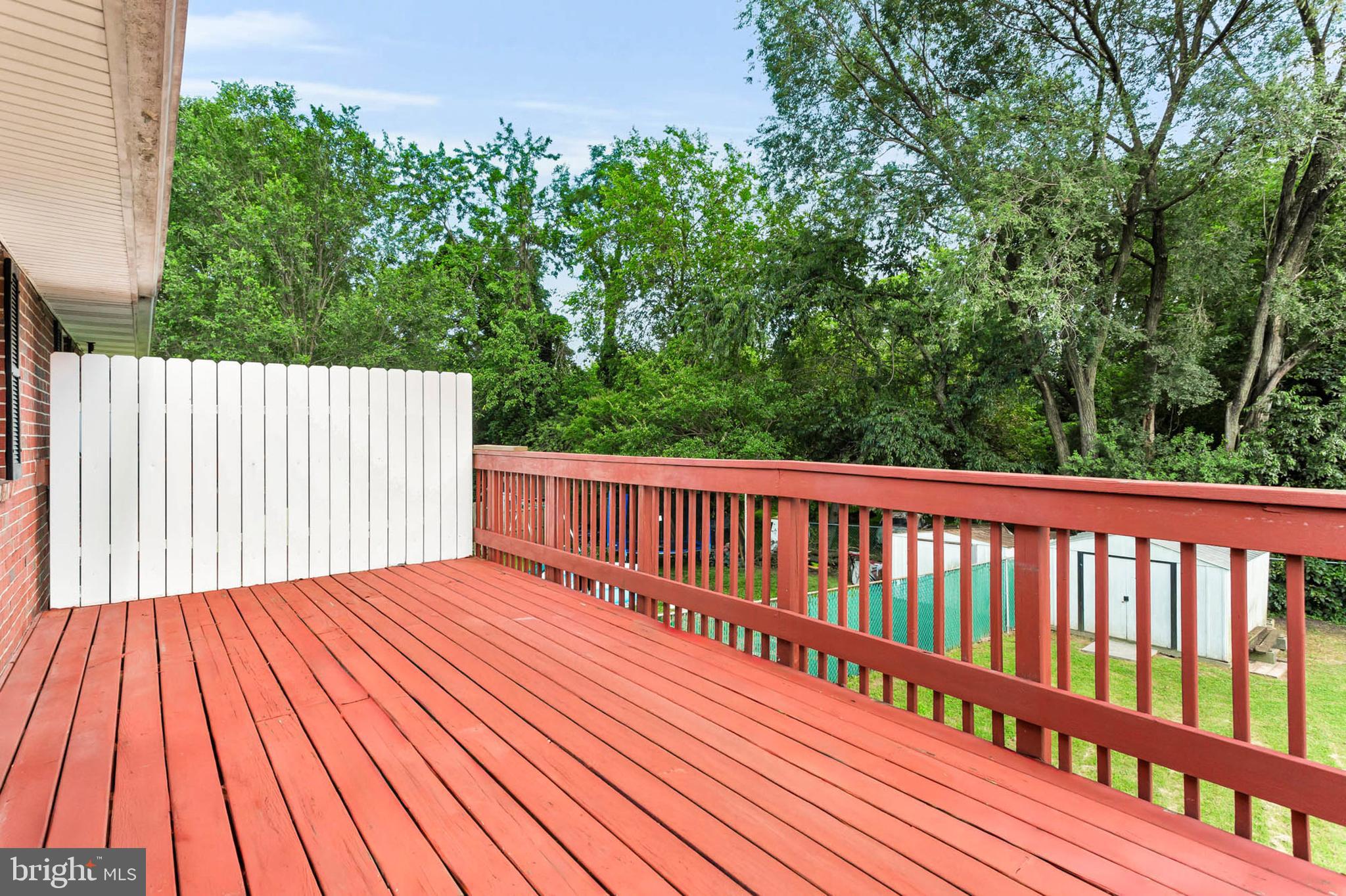 179 Dunlap Road Pasadena, MD 21122 - Photo 29 of 36 Expansive deck spans entire length of home!