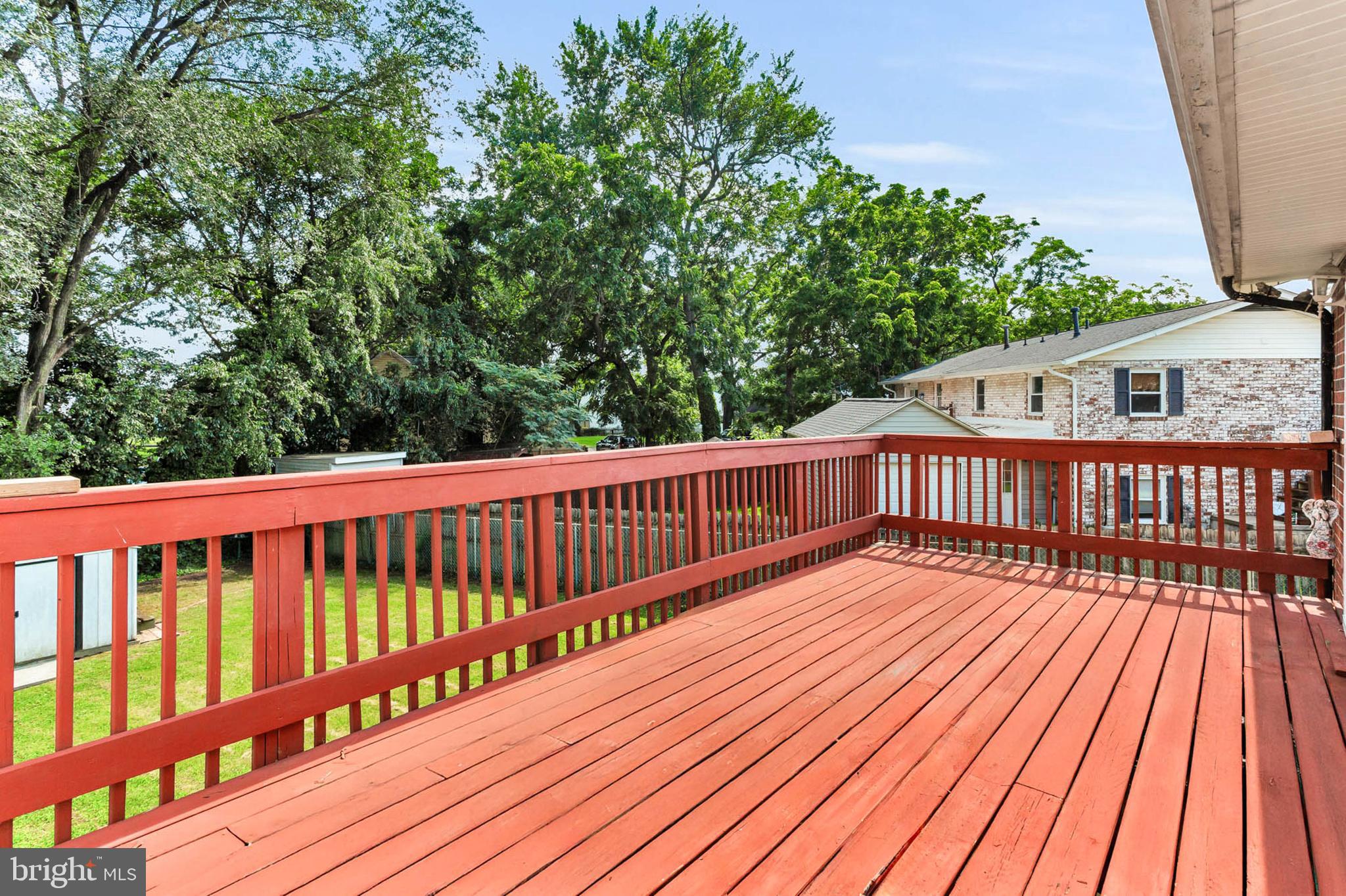 179 Dunlap Road Pasadena, MD 21122 - Photo 30 of 36 Expansive deck spans entire length of home!