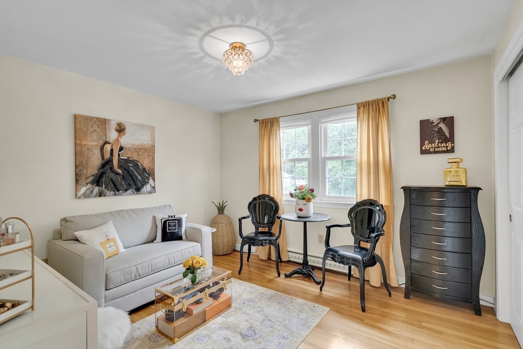 71 Stone Street, Unit 5 Walpole, MA 02081 - Photo 14 of 18 a living room with furniture a two piano and a large window