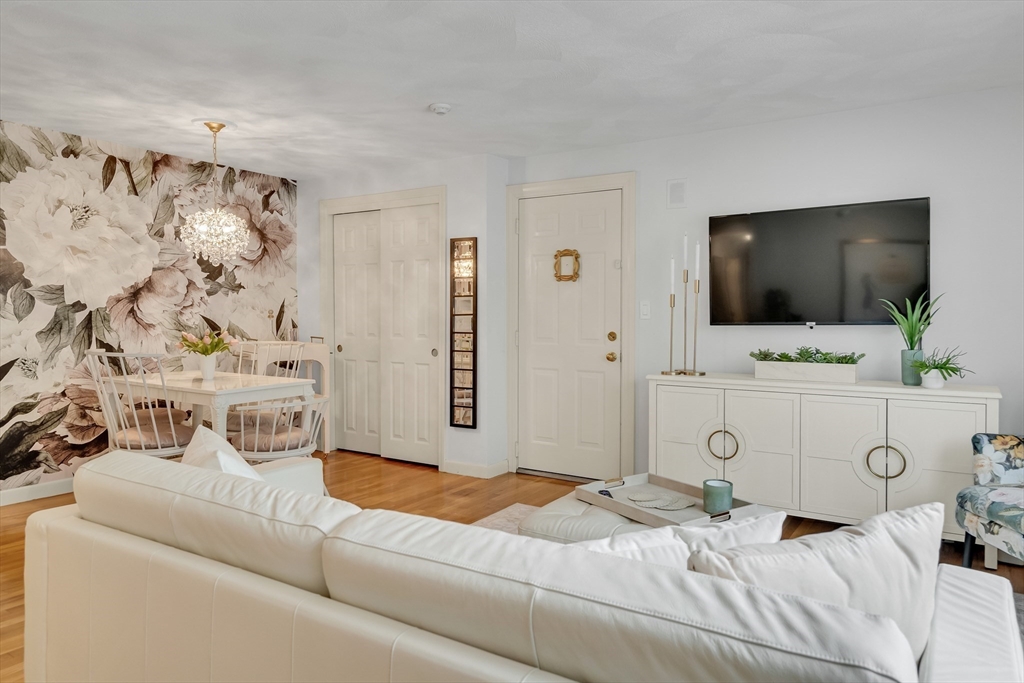 71 Stone Street, Unit 5 Walpole, MA 02081 - Photo 6 of 18 a bedroom with a bed and a flat screen tv