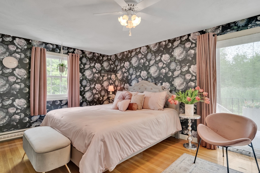 71 Stone Street, Unit 5 Walpole, MA 02081 - Photo 9 of 18 a bedroom with a bed and a window