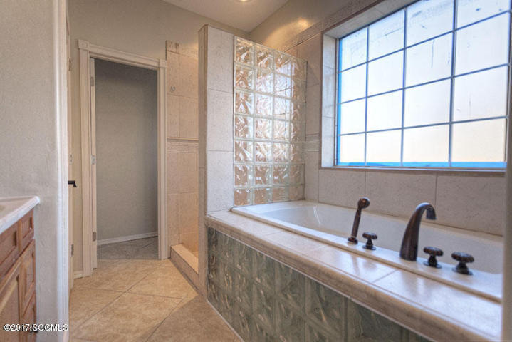 430 Churea Lane Rio Rico, AZ 85648 - Photo 13 of 14 a bathroom with a sink and a bathtub