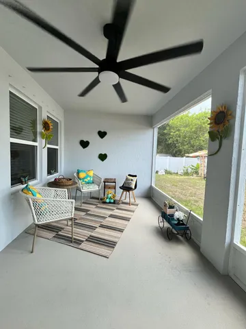 a bedroom with furniture and a window