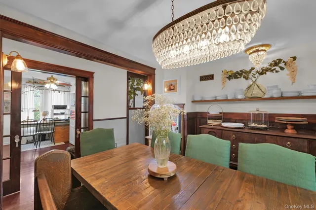 a dining room with furniture and wooden floor