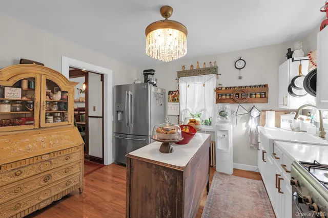 a kitchen with stainless steel appliances granite countertop a stove and a refrigerator