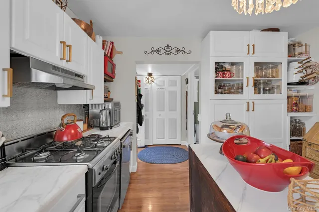 a bathroom with a sink a vanity and a window