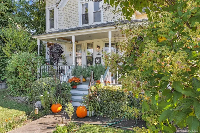 front view of a house with a chairs