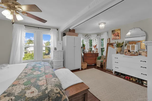 a bedroom with bed and a window