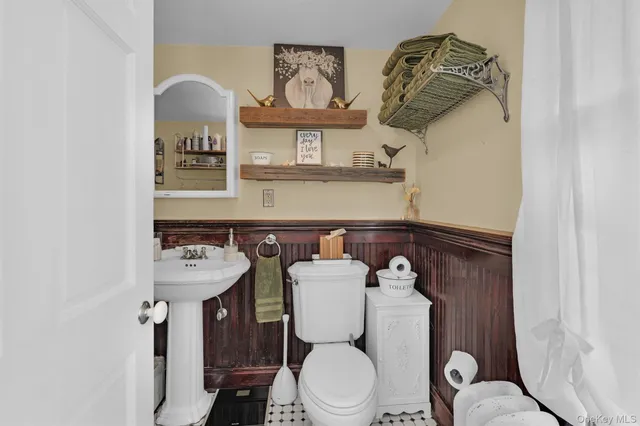 a white bench sitting in front of a building