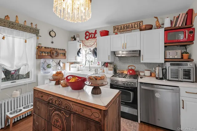 a kitchen with a white cabinets and white appliances