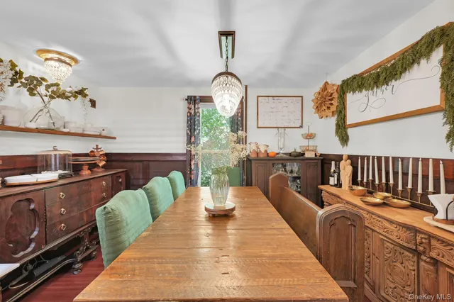 a balcony with chairs and view of living room