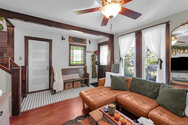 a living room with furniture and a window