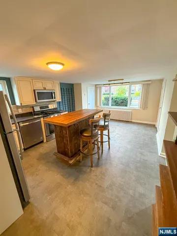 a bed room with a bed and a television