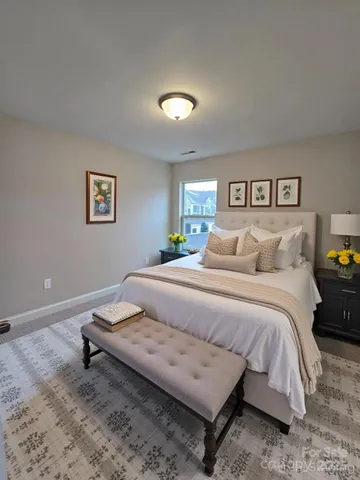 a bedroom with a bed and night stand