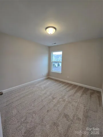 an empty room with a empty space and window