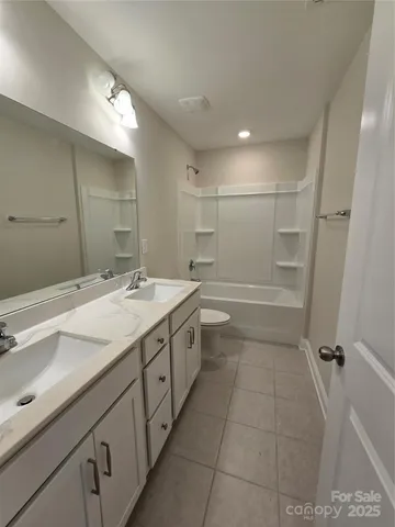 a view of a room with a wooden floor