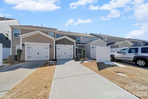a view of a hallway with wooden wall and entryway