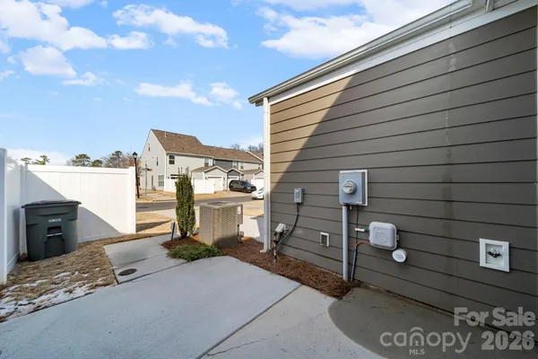 a view of a brick building next to a yard