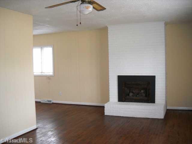 7309 Kingston Road Trinity, NC 27360 - Photo 2 of 11 Living Room. Beautiful masonry fireplace in Living Room. Great hardwoods.