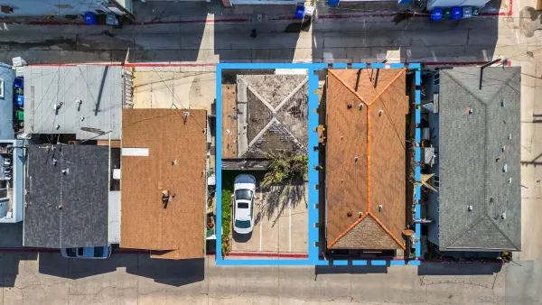 a view of a house with a street