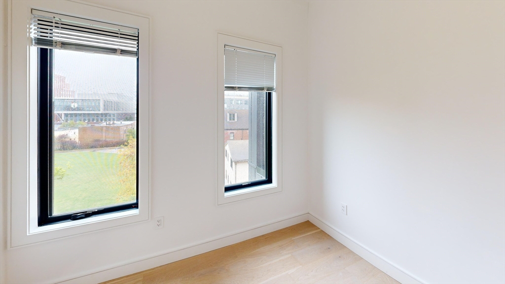 50 Leo M Birmingham Parkway, Unit 506 Boston, MA 02135 - Photo 4 of 10 an empty room with a window