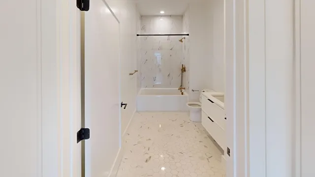 a bathroom with a bathtub and shower
