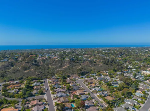 an aerial view of multiple house with yard