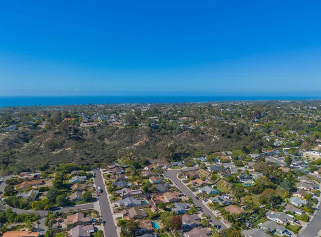 an aerial view of multiple house with yard