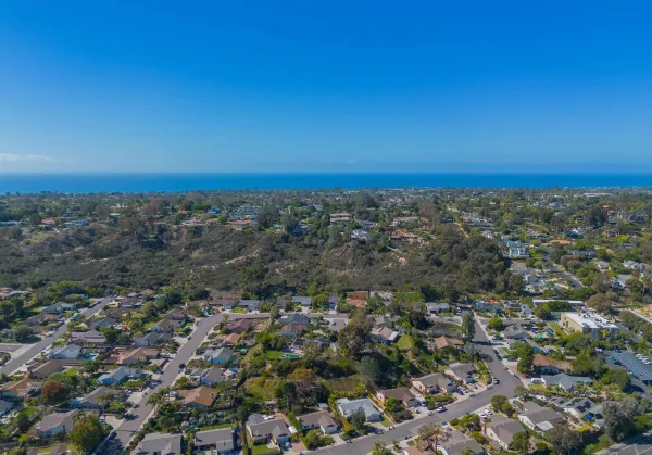 an aerial view of residential building and green space
