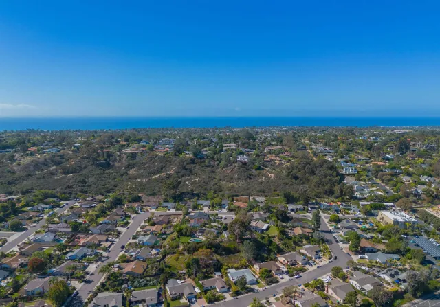 an aerial view of residential building and green space