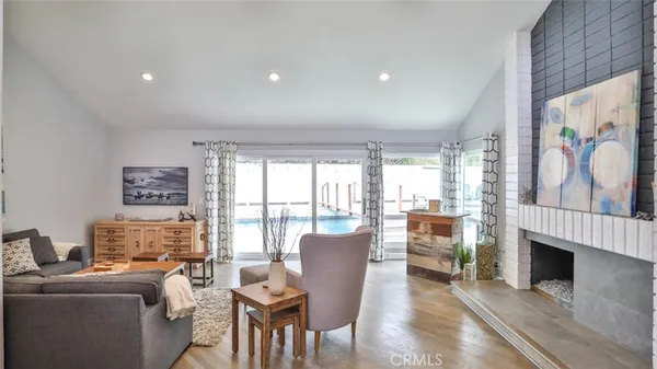 a dining room with furniture and wooden floor