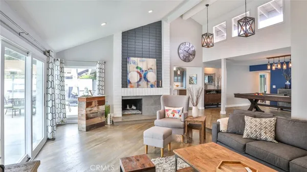a dining area with a table chairs and a kitchen view