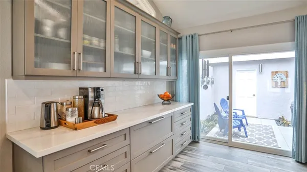 a bedroom with a bed and a mirror on the dresser