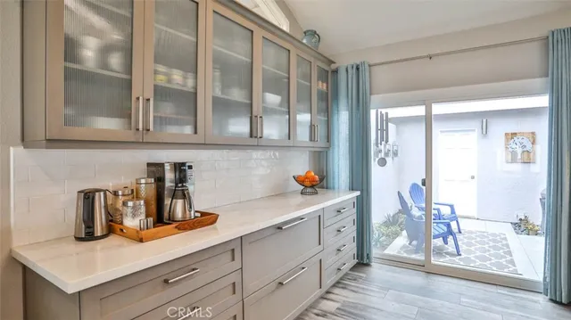 a kitchen with stainless steel appliances granite countertop a stove and a refrigerator