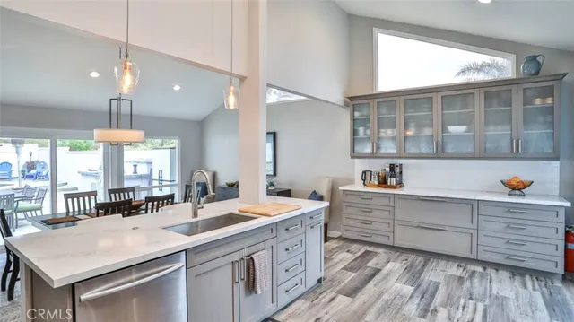 a bedroom with a bed flat screen tv and a large window