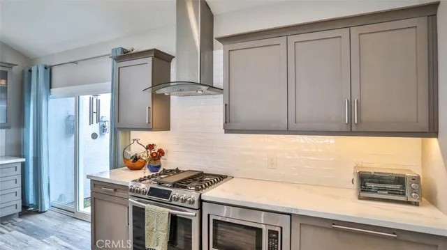 a bedroom with a bed and large windows