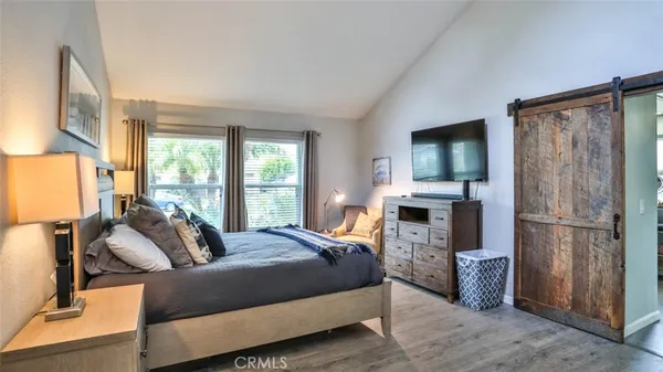 a bathroom with a granite countertop shower a mirror and a sink