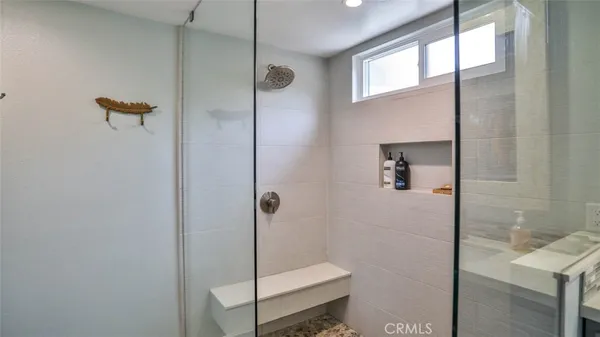 a view of a swimming pool with a lounge chair