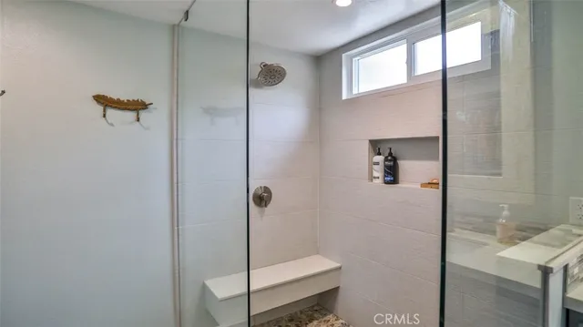 a bedroom with bed and a chandelier