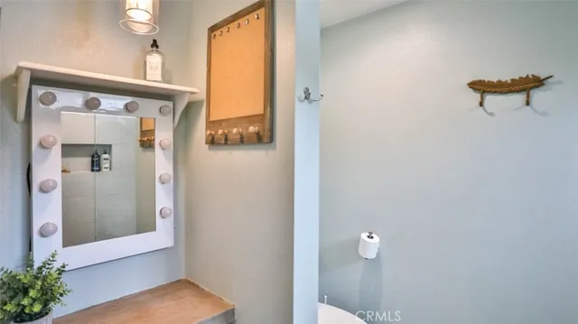 a bedroom with a bed and a lamp