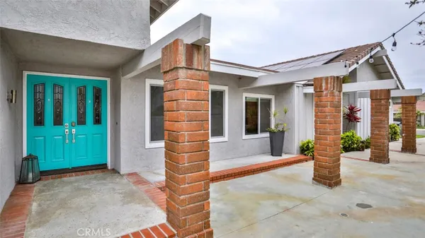 a room with furniture and a chandelier