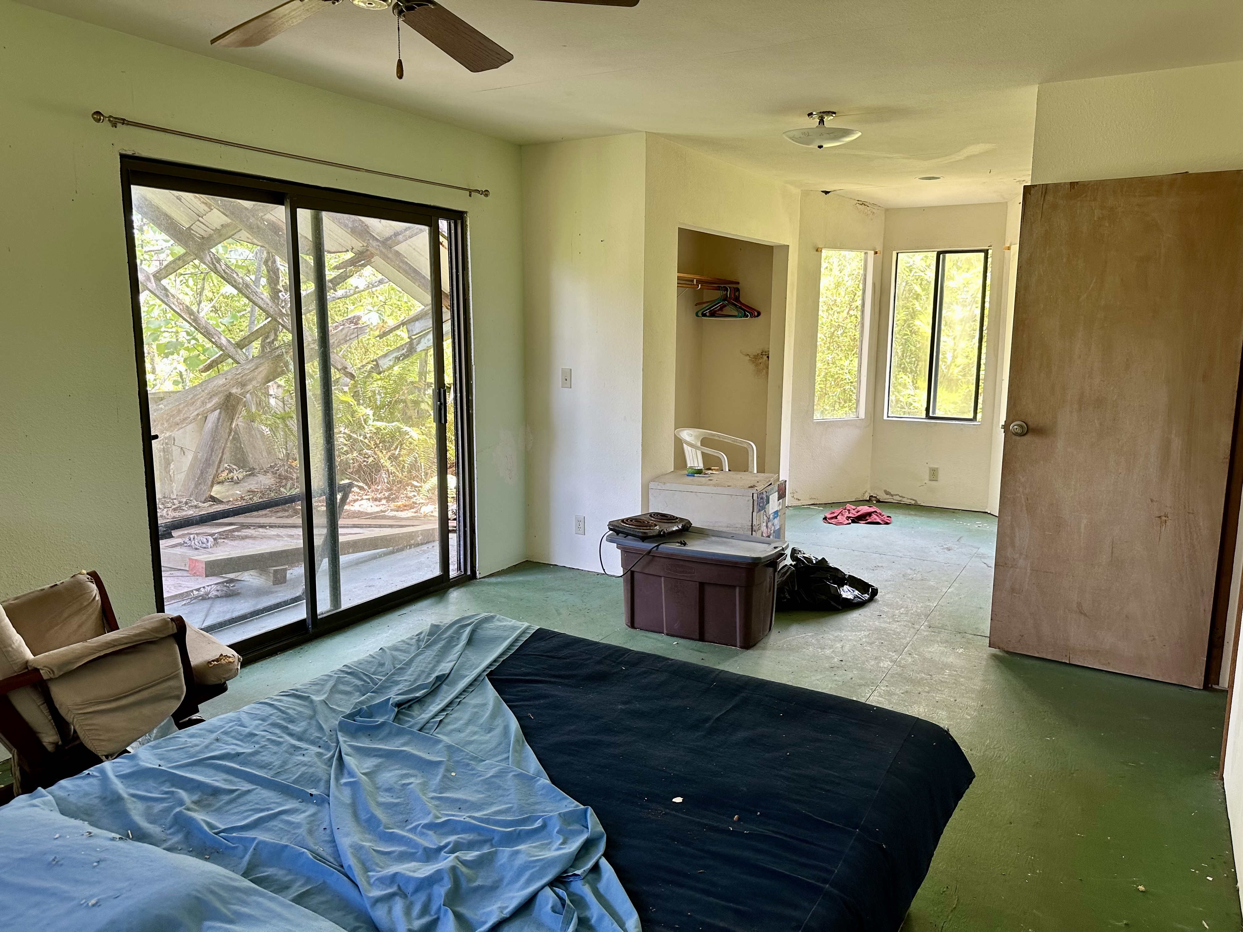 15-1105 Ama U Road Keaau, HI 96749 - Photo 16 of 29 a living room with furniture and a gate