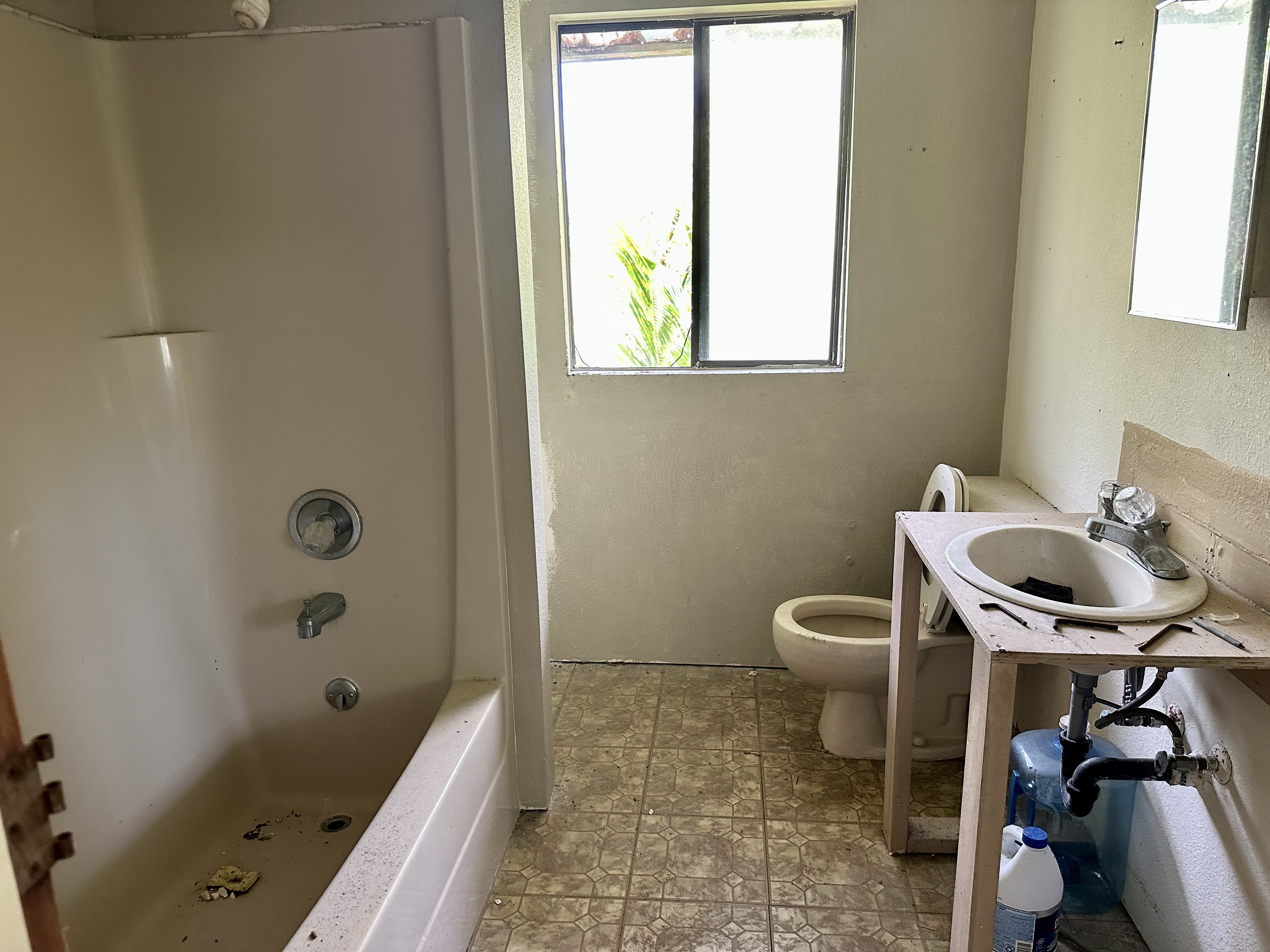 15-1105 Ama U Road Keaau, HI 96749 - Photo 21 of 29 a bathroom with a sink a toilet and shower