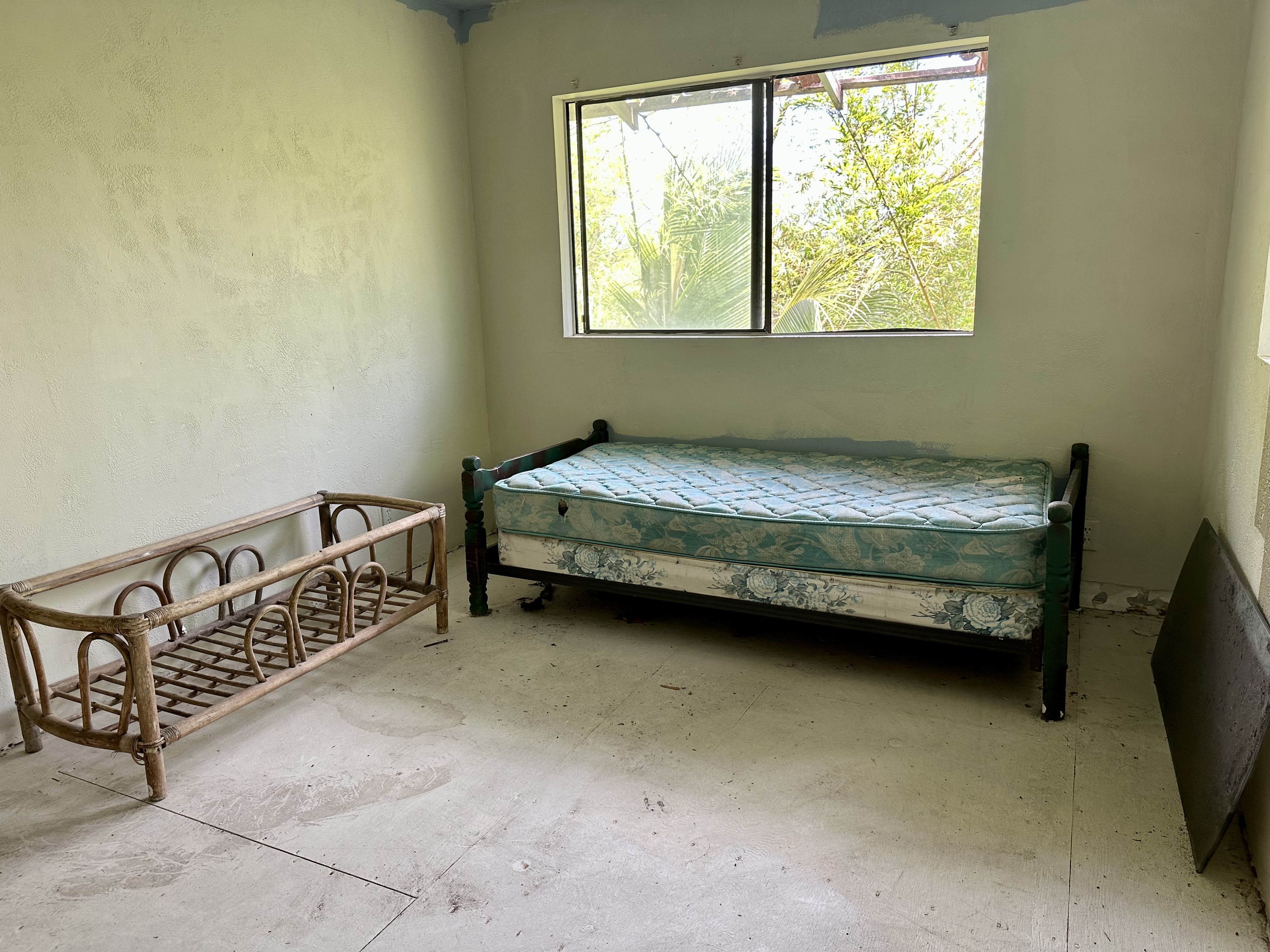 15-1105 Ama U Road Keaau, HI 96749 - Photo 22 of 29 a bedroom with a bed chair and window