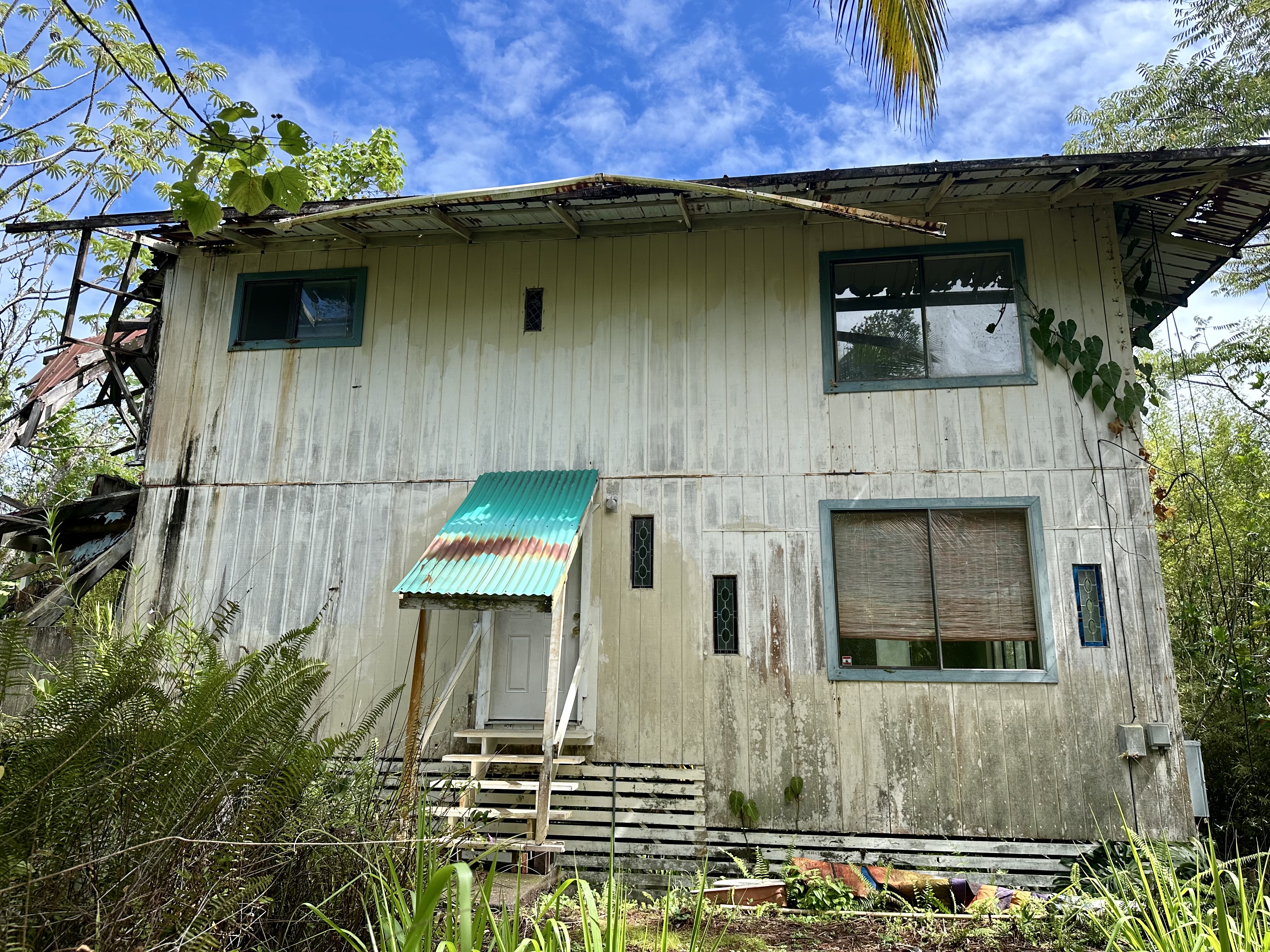 15-1105 Ama U Road Keaau, HI 96749 - Photo 26 of 29 a front view of a house with a garden