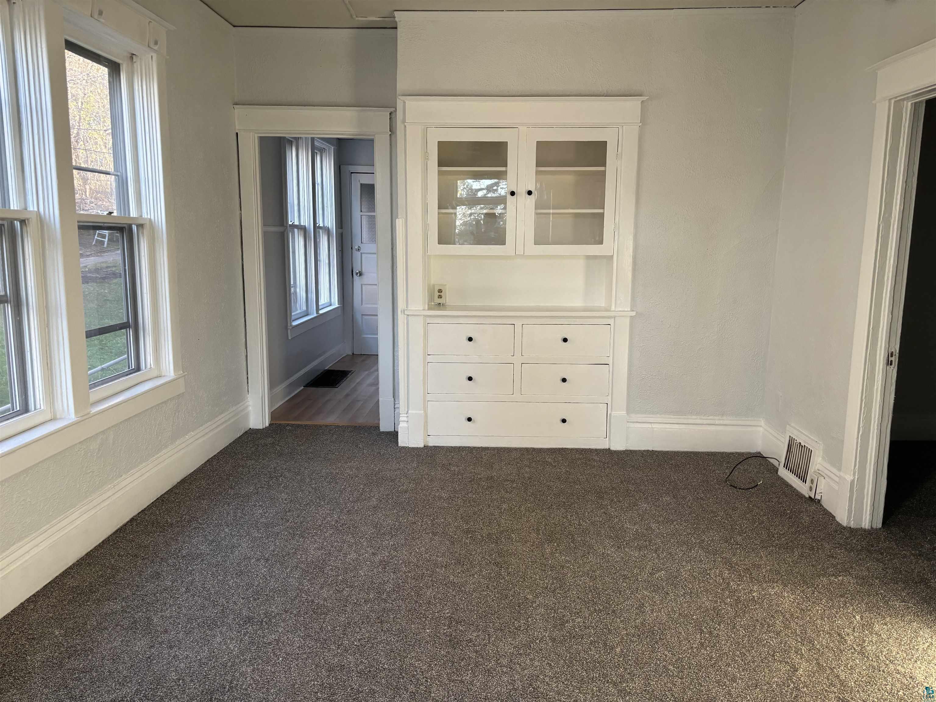 2967 Exeter Street Duluth, MN 55806 - Photo 11 of 31 Spare room featuring dark colored carpet and a wealth of natural light